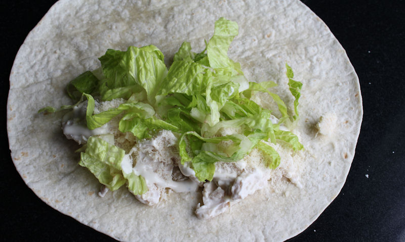 Shredded lettuce in tortilla wrap
