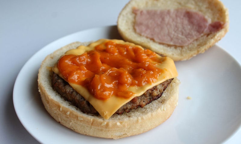 Rustlers deluxe with added cheese and sauce