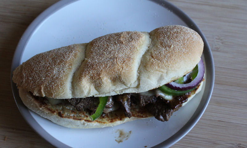 Steak cheese sub on plate