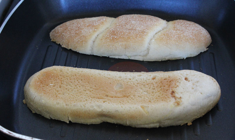 Toasting sub rolls face down in pan