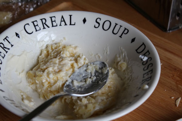 Cheese and mayonnaise mixed in cereal bowl