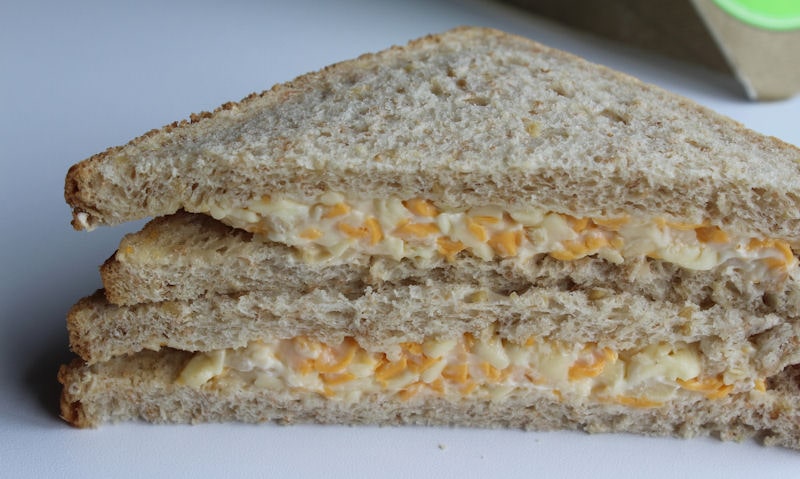 Tesco cheese and onion sandwich cut in half