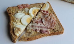 Tesco Egg & Bacon Sandwich, halves on display