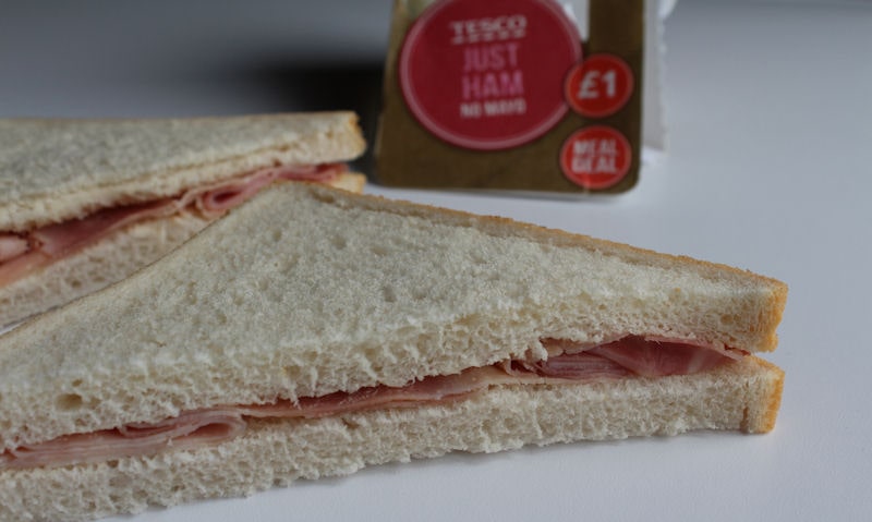 Two sandwich halves laid out on surface