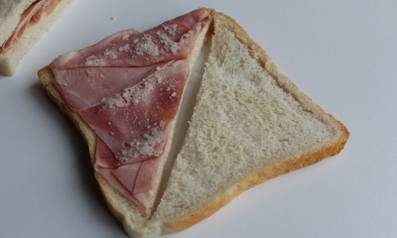 Opened bread reveals ham