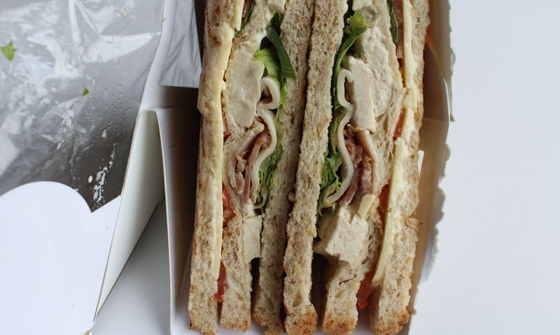 Club sandwiches still in packet, ripped open