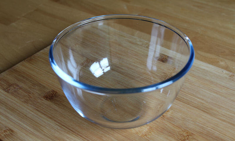 Empty Pyrex bowl sitting on chopping board